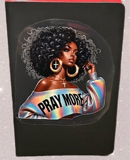 Black notebook with a decal. This is an example and not the final look.